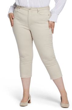 Stylish released hems punctuate these casual-cool jeans cut in a cropped silhouette. Exclusive Lift Tuck® Technology smoothes and supports in front and lifts in back. 23" inseam; 16" leg opening; 12 3/4" front rise; 19 1/2" back rise Zip fly with button closure Five-pocket style 88% cotton, 10% polyester, 2% elastane Machine wash, dry flat Imported Spring Cropped Jeans, Casual Knee-length Capris For Fall, Knee-length Cropped Jeans With Pockets For Spring, Knee-length Cropped Jeans For Spring, Spring Knee-length Cropped Jeans With Pockets, Spring Casual Cropped Capri Jeans, Casual Mid-calf Bottoms For Fall, Relaxed Fit Capris For Fall, Spring Mid-rise Capris