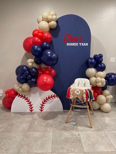 balloons and baseballs are on display in the room