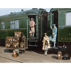 an old photo of people loading luggage onto a train car and another woman standing next to it