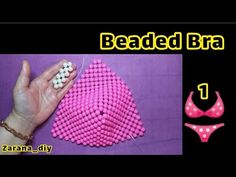 the beaded bra is being made with pink beads and white polka dots on it