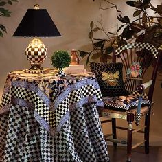 a table with two chairs and a lamp on it