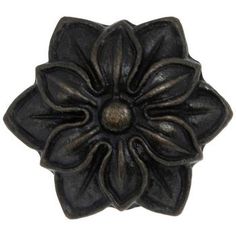 a black flower shaped object on a white background