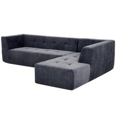 a gray couch and ottoman sitting next to each other