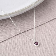 This birthstone necklace in Garnet  boasts a stunning natural garnet gemstone on an elegant 16" sterling silver or 18ct gold-plated sterling silver chain, believed to offer healing properties that provide protection, love, and energy. Perfect for layering, this ensures a truly one-of-a-kind piece of Garnet gemstone jewellery that is sure to leave a lasting impression, making it the perfect birthday present to gift. Supplied with Birthstone info card for the recipient. Garnet: reduce inflammation Garnet Birthstone, June Birthstone Jewelry, Zodiac Jewelry, Jewelry Ring Box, Gifts For New Mums, Gemstone Jewellery, Pearl Jewellery Earrings, Men's Jewelry Rings, Evil Eye Jewelry