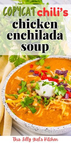 a bowl of chicken enchilada soup with cilantro and sour cream