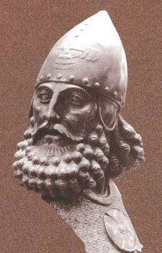 a statue of a bearded man wearing a helmet