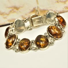 BALTIC AMBER & STERLING Silver Link Bracelet, Oval Amber Chain Bracelet, Estate Amber Jewelry, Holiday Gift Idea For Her, Unisex Bracelet by ANTIQUE4YOU UNIQUE ESTATE AMBER & STERLING SILVER LINK BRACELET. FITS WRIST UP TO 6.5" 3/4" wide. COMPOSITION OF 9 OVAL AMBER CABOCHONS and STAMPED STERLING SILVER. UNISEX GIFT IDEA. *BEFORE PLACING ORDER, PLEASE, MAKE SURE YOUR ADDRESS IS CORRECT IF YOU PLACED ORDER WITH UNVERIFIED ADDRESS OR HAD MISTAKE IN IT AND IF PACKAGE RETURNED FOR THIS REASON SHIPPI Vintage Adjustable Bracelet With Oval Links, Handmade Oval Sterling Silver Bracelet In Vintage Style, Vintage Adjustable Oval Link Bracelets, Formal Adjustable Oval Bracelet, Adjustable Oval Sterling Silver Bracelet Nickel Free, Adjustable Oval Metal Bracelets, Adjustable Oval Jubilee Bracelet, Adjustable Silver Oval Chain Bracelet, Adjustable Oval Silver Chain Bracelet