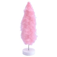 a pink fluffy object on a white stand