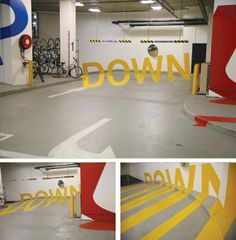 the inside of a parking garage with yellow lettering