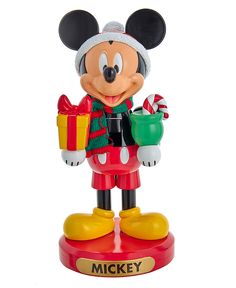 a mickey mouse figurine holding a christmas present