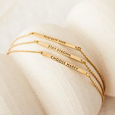 Our inspiration bracelet features a gold bar pendant with the reminder to STAY STRONG. A meaningful gift for someone who could use a pick-me-up. Features a 30mm x 2mm bar and a sliding bead that adjusts to your wrist. The bracelet fits wrists measuring up to 6.75" around. Inspirational Gold Name Bracelet For Friendship, Inspirational Gold Bracelets For Best Friend, Inspirational Gold Bracelet For Best Friend Gift, Inspirational Gold Name Bracelet For Personalized Gift, Inspirational Gold Bracelet For Best Friend, Gold Bar Pendant, Gold And Silver Bracelets, Silver Bracelets For Women, Bar Pendant