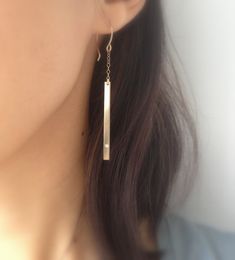 Simple and sleek, these lightweight gold diamond bar earrings are just gorgeous. So easy to wear with almost any outfit. Hand-formed 14k gold fill french hooks with 14k gold fill chain and bar. I flushed set a tiny diamond cz on the ends of each bar. 2 1/8 inches long from chain to bar. I provide two clear rubber backings with these earrings. If you would like a complete matching set, here are links to matching necklaces and a bracelet: Necklaces - 1) https://www.etsy.com/listing/192922687/horiz Simple 14k Gold Earrings, Simple Linear Earrings For Everyday Wear, Simple Everyday Drop Earrings, Minimalist Linear Earrings For Anniversary, Simple Single 14k Gold Earring, Minimalist Single Linear Earring For Anniversary, Modern Everyday Drop Diamond Earrings, Modern Drop Diamond Earrings For Everyday Wear, Elegant Single Threader Earring For Everyday