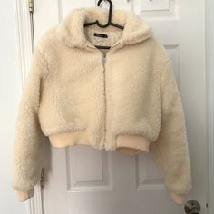 Never Worn, Been Sitting In My Closet! In Excellent Condition Cute And Super Warm!! Faux Fur 100% Polyester. Backing 100% Polyester. Lining 100% Polyester. Trendy Cream Cropped Winter Jacket, Cream Long Sleeve Cropped Jacket For Winter, Bomber Jackets, Faux Fur, Bomber Jacket, Jackets & Coats, Size 4, Jackets For Women, Cream