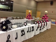 a table topped with lots of musical themed items