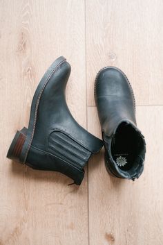 The Clyde Boot is the perfect blend of rugged and refined, offering a timeless silhouette with a modern twist. Crafted from smooth black faux leather, this ankle boot features classic Chelsea boot elastic side panels paired with a discreet back zipper for easy wear. The sturdy stacked wooden heel and contrast stitching around the sole provide both durability and a stylish edge. Whether dressing up or keeping it casual, the Clyde Boot is a versatile staple for any fall or winter wardrobe.

Closure: back zipper
Toe Shape: round
Heel Height: 1.5 inches
Platform Height: 0.5 inches
Shaft Height: 5 inches
Calf Circumference: 11 inches
Materials: faux leather
Insole: Yellow Box custom contoured insole
Outsole: rubber Wooden Heel, Sandals For Sale, Chelsea Boot, Boyfriend Fit, Side Panels, Ring Collections, Black Faux Leather, Winter Wardrobe, Easy Wear