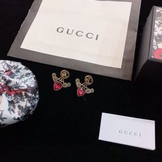 SHOP MORE LUXURY PRODUCTS HERE Description Gucci Earings GG signGold color hardware This product is the premium quality. This product will come with box. Designer Red Earrings For Gifts, Gucci Earrings, Gucci Gg Belt, Gg Belt, Louis Vuitton Shirt, Chanel Shirt, Gucci Jewelry, Jewels Rings, Gucci Gg Marmont