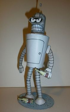 a paper mache robot is standing on a table