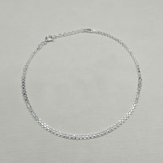 Metal: Sterling Silver Weight: 2.5 grams Chain Width: 2mm Total Bracelet Length: 9-10 inches Stamped: 925 A ladies sterling anklet adjustable between 9 and 10 inches in length. The ankle bracelet is made from a flat 2mm wide bismark chain. Free UK delivery with Royal Mail. Returns accepted within 30 days, at buyer's cost. Sterling Silver Adjustable Delicate Chain Bracelet, Minimalist Sterling Silver Anklet With Adjustable Chain, Adjustable Hypoallergenic Silver Anklet, Adjustable Sterling Silver Chain Anklet, Minimalist Silver Anklets With Adjustable Chain, Dainty Silver Anklet With Adjustable Chain, Adjustable Hypoallergenic Sterling Silver Anklets, Dainty Adjustable Sterling Silver Anklets, Cross Earrings Studs