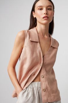 "LUCY is a collared linen vest. DETAILS - Fits true to size - Collared - Sleeveless design - Small coconut buttons closure, also available with large coconut buttons - 100% lightweight European linen fabric - Cut and sewn to order just for you in our studio COLOR - Camel, you can also choose other colors above - Fabric samples are available here https://www.etsy.com/listing/586569696/linen-fabric-samples SIZING & FIT - Relaxed, loose fit - Model is 5'9.5\" / 177cm tall and usually wears size S CARE FOR LINEN - Machine wash up to 30ºC/86ºF gentle cycle - Lay flat to dry or tumble dry low - Warm iron if needed - Do not bleach SIZE GUIDE Size conversion guide Size XS (US 0-2, IT 36-38, UK 4-6, Japan 3-5, France 32-34) Size S (US 4-6, IT 40-42, UK 8-10, Japan 7-9, France 36-38) Size M (US 8-10 Womens Linen Shirt, Sleeveless Linen Shirt, Shirt Linen Woman, Sleeveless Button Up Shirt Outfit, Sleeveless Outfits For Women, Sleeveless Button Up, Sleeveless Button Down Shirt Outfit, Sleeveless Shirt Outfit, Loose Tops For Women