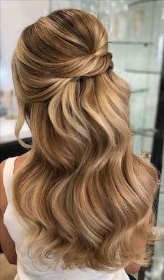 a woman with long blonde hair in a salon