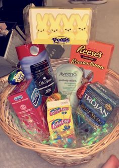 a basket filled with lots of different types of food and candys on top of a table