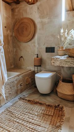 a bathroom with a tub, toilet and rug