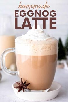 homemade eggnog latte in a glass mug with whipped cream and anise on top