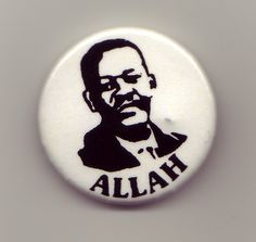 a white button with a black image of a man's face and the words allah printed on it