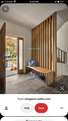 an image of a room with stairs and wooden slats on the wall, as well as a phone