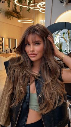 Discover 23 stunning ideas for brown fall hair colors, from rich chocolates to golden brown, dark auburn, and natural curly hair hues. Explore the latest trends for fall hair colors, including balayage, highlights, and layered styles for dark and light brown hair. Perfect for brunettes, featuring short, medium, and long lengths. Light Golden Brown Hair Balayage, Brunette Hair Ideas Fall, Autumn Skin Hair Color, Blond And Brown Curly Hair, Low Maintenance Brown Highlights, Dark Brown Hair Golden Undertones, Brown Hair For Medium Skin Tone, Golden Brunette Highlights, Carmel Honey Brunette