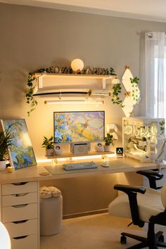 a home office with desk, computer monitor and plants on the shelves above it is lit up