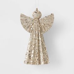 an angel ornament hanging from a string