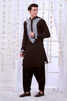 Black straight kurta with contrasting white paisley pattern dori embroidered bodice and cuffs. Comes with solid pyjama. - Aza Fashions Traditional Straight Kurta Sets With Embroidered Sleeves, Bollywood-style Fitted Kurta With Embroidered Sleeves, Traditional Sets With Embroidered Sleeves For Festivals, Fitted Long Sleeve Kurta With Embroidered Cuffs, Traditional Festival Sets With Embroidered Sleeves, Wedding Sets With Embroidered Cuffs For Eid, Traditional Salwar Kameez With Embroidered Sleeves, Elegant Kurta With Embroidered Cuffs For Eid, Bollywood Traditional Wear With Embroidered Sleeves For Eid