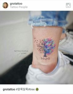 a small tree tattoo on the ankle