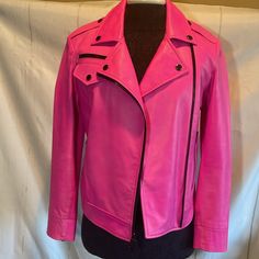 Dkny Hot Pink Barbie Biker Jacket Features Classic Heritage Features That Will Stand The Test Of Time. Style Yours With A Tank And Jeans Or A Black Dress. Peak Lapels Long Sleeves Double-Breasted Zip Front Zip Cuffs Front Zip Pockets Pin Buckle Belted Hem Lined Lambskin Leather Dry Clean By Leather Specialist. Preowned And Had Some Slight Wear. See Photos Or Ask Questions Prior To Purchase. In Overall Very Nice Condition. 23” From Shoulder To Hem In Front. Sleeve Is 23” From Shoulder To Wrist. A Hot Pink Leather Jacket, Biker Clothes, Barbie Hot Pink, Hot Pink Barbie, Pink Leather Jacket, Biker Outfit, Pink Barbie, Leather Moto, Leather Moto Jacket