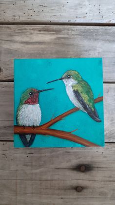 a painting of two hummingbirds sitting on a branch