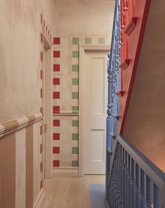 the hallway is painted in different colors and patterns