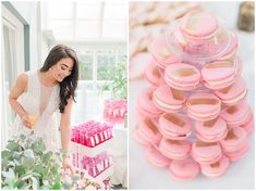 a woman standing next to a table filled with pink macaroons