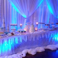 a table topped with lots of cakes and desserts