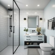 a bathroom with white tile and black accents on the walls, along with a walk in shower