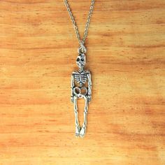 ♥ Skeleton Necklace Silver Skeleton Charm Necklace Skeleton Gift Halloween Charms Christmas Gift Personalized Necklace ♥ This is a beautiful skeleton charm with ♥ You will receive 1 necklace ♥ Skeleton charm 39x9x3 mm ♥ Stainless steel chain 18 inches ♥ We strive for next day shipping, but we do not ship on Saturdays, Sundays, and Holidays. It may sometimes take a bit longer when we have unusually large volume of orders. Thank you for your patience! ♥♥ For more details on shipping guideline and Halloween Skull Jewelry In Bone Color, Halloween Skull Shaped Bone Jewelry, Spooky Skull Jewelry For Gifts, Halloween Skull Jewelry For Jewelry Making, Halloween Jewelry Making Skull Beads, Halloween Skull-shaped Jewelry For Jewelry Making, Halloween Skull-shaped Jewelry Making Supplies, Skull-shaped Bone Jewelry For Gifts, Skull Shaped Bone Colored Jewelry For Gifts