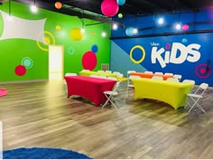 a brightly colored room with tables and chairs for children's birthday party or event