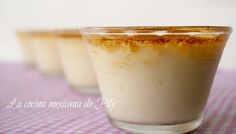 three dessert cups sitting on top of a pink and white checkered tablecloth covered table