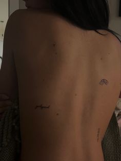 a woman with a tattoo on her back