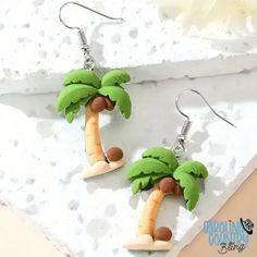 Embrace the tropics and take a risk with our Coconut Multi earrings! Featuring vibrant palm trees, these earrings will add a touch of adventure to any outfit. Show off your bold style with this must-have accessory. Measures 1 1/4" Sold as one pair of earrings. Green Novelty Jewelry For Summer, Novelty Green Summer Jewelry, Green Novelty Summer Jewelry, Fun Beach Season Jewelry For Vacation, Casual Drop Earrings For Beach, Casual Drop Earrings For Vacation, Casual Beach Season Earrings For Vacation, Casual Beach Earrings, Casual Beach Vacation Earrings