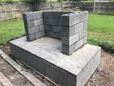 a cinder block sitting in the middle of a yard