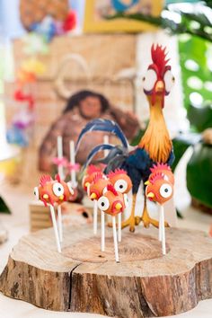 there are some cake pops with chicken faces on them