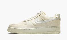 The Stussy x Nike Air Force 1 Low “Fossil” is a Winter 2020 colorway produced by the California streetwear brand and Nike.  Releasing exclusively in Stussy Chapter stores and online, the “Fossil” employs the same neutral cream based design as Stussy’s collaborative Nike Air Zoom Spiridon Caged of the same nickname from Spring 2020.  The “Fossil” employs a rugged canvas material to the entire upper except for the white Swoosh and Stussy embroidery that appears on the mid-panel and toe, respective Stussy Fossil, Yeezy 750, Nike X Travis Scott, Embroidered Heels, Low Air Jordan 1, Converse Run Star, Air Force One, Jordan 2, Nike Dunk High