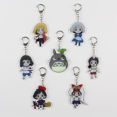 six key chains with cartoon characters on them