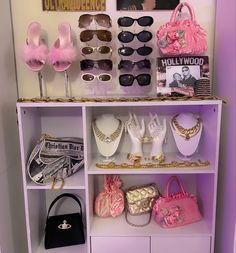 a shelf filled with lots of different types of purses and sunglasses on top of it